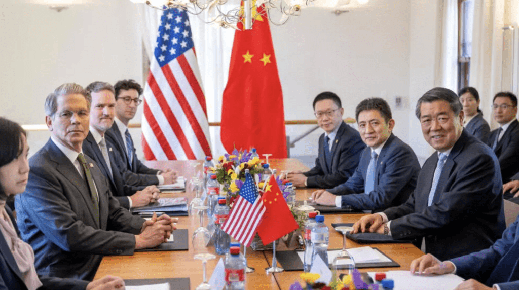图为中美双方早前在日内瓦举行会议。